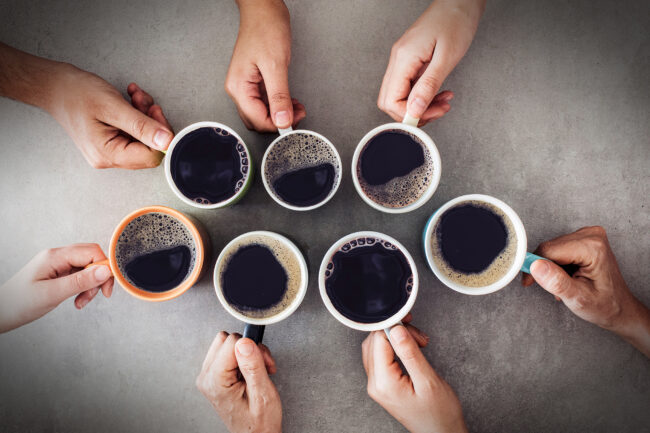 People hands holding cups of coffee
